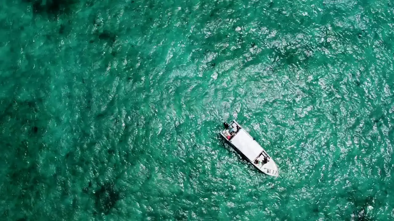 Aerial View of a fishing boat in the middle of the Caribbean sea