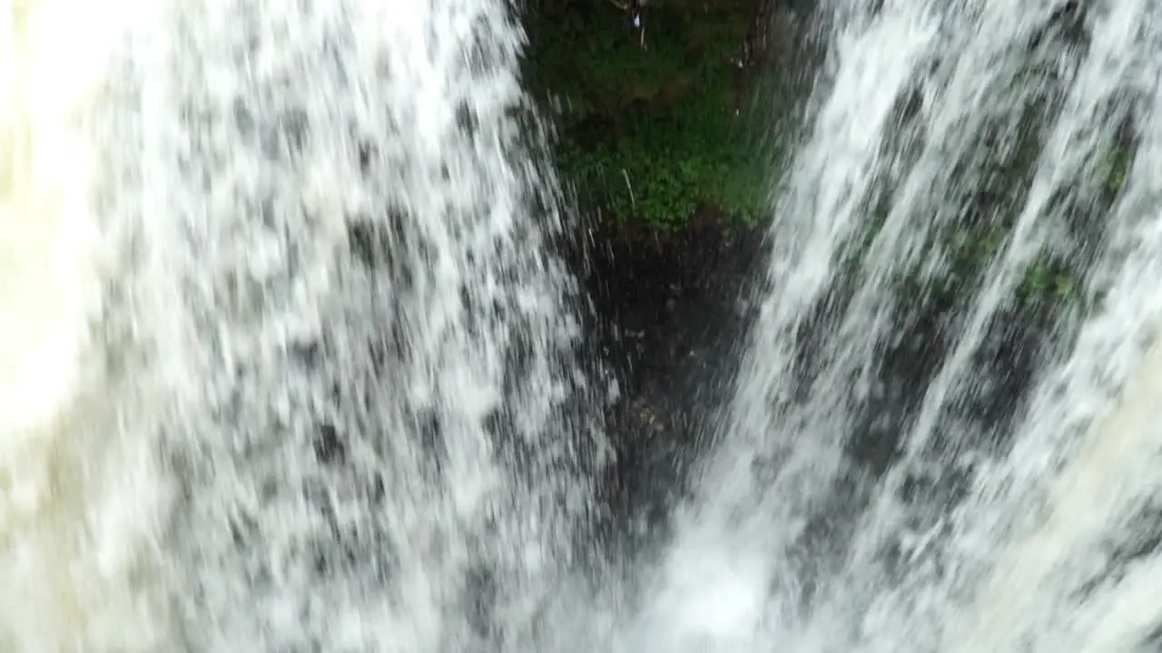 Camera filming down into a large waterfall in Java