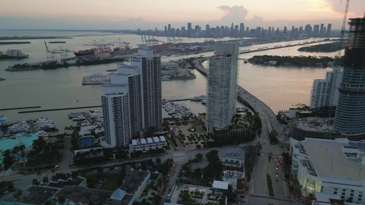 cityscape skyline of Miami at sunset with downtown and south beach port