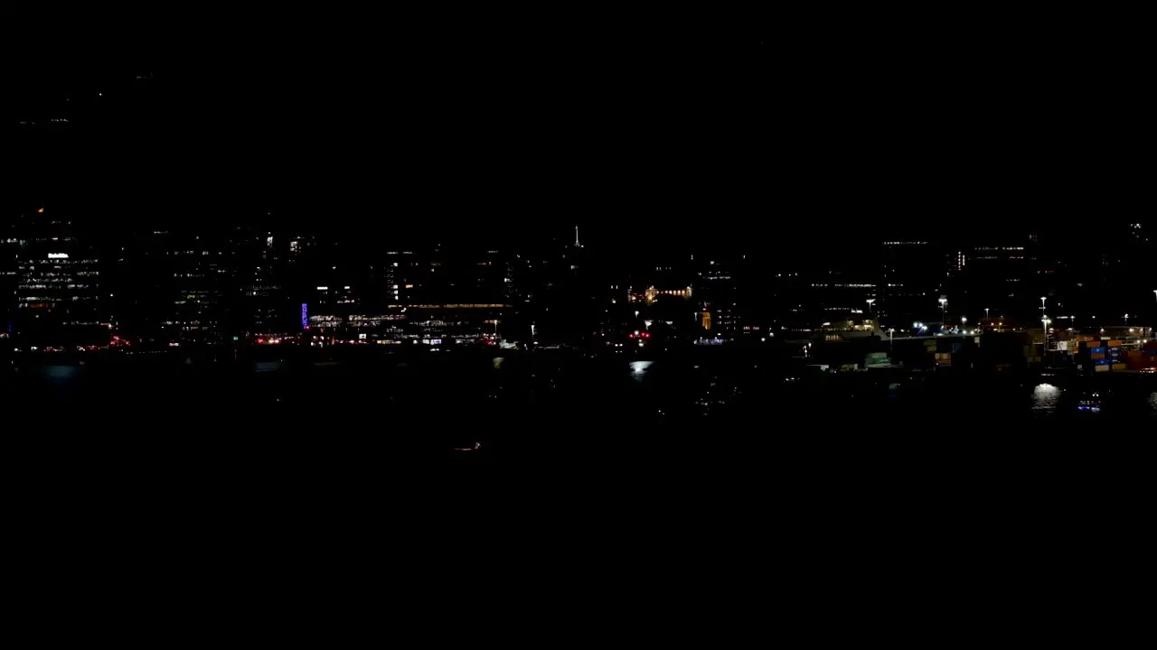 Dark cityscape of flickering and flashing night lights of urban inner city capital Wellington New Zealand Aotearoa