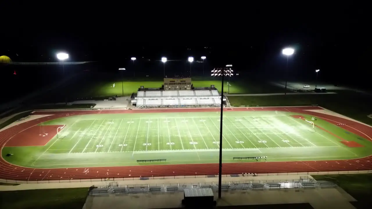 Nighttime Aerial Drone Footage Football Field At Statesmen Community Stadium William Penn University Oskaloosa Iowa