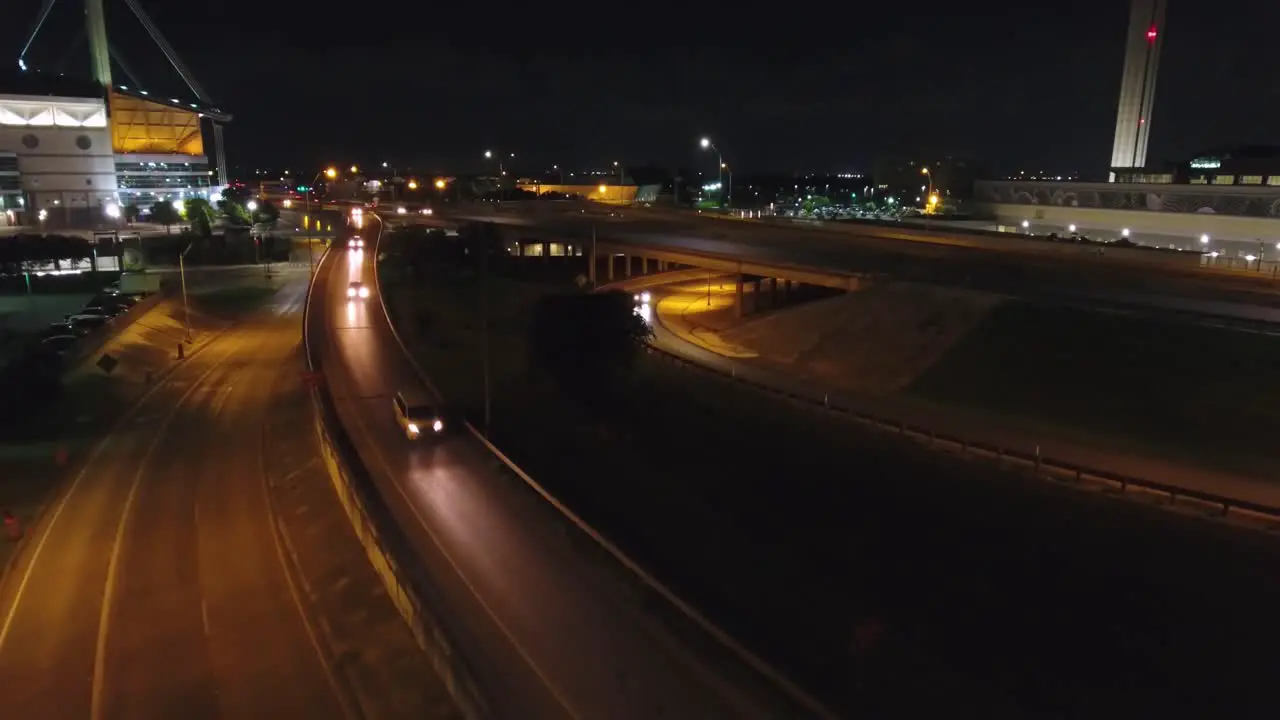 An aerial nighttime flyover of a San Antonio highway