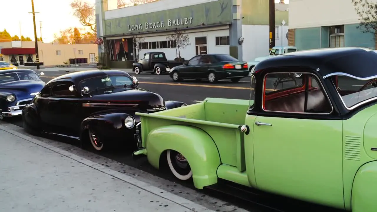 Lowriders in the street at sunset