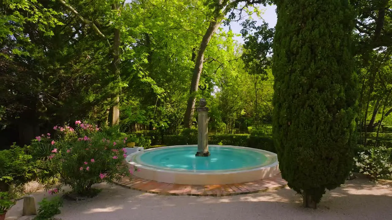 Moonlit Oasis Enchanting Fountain Surrounded by Luxuriant Greenery