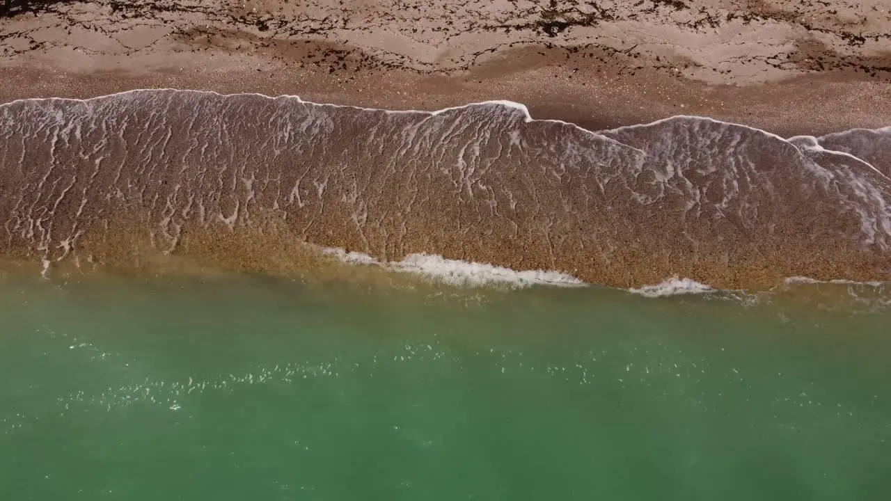 Aerial View Of Sandy Beach And Turquoise Water