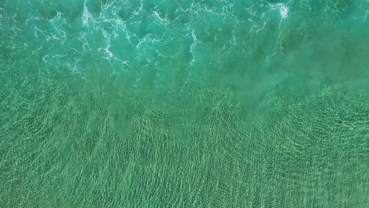 4k Top view aerial shot of small tide waves close to the shore at Byron Bay Australia