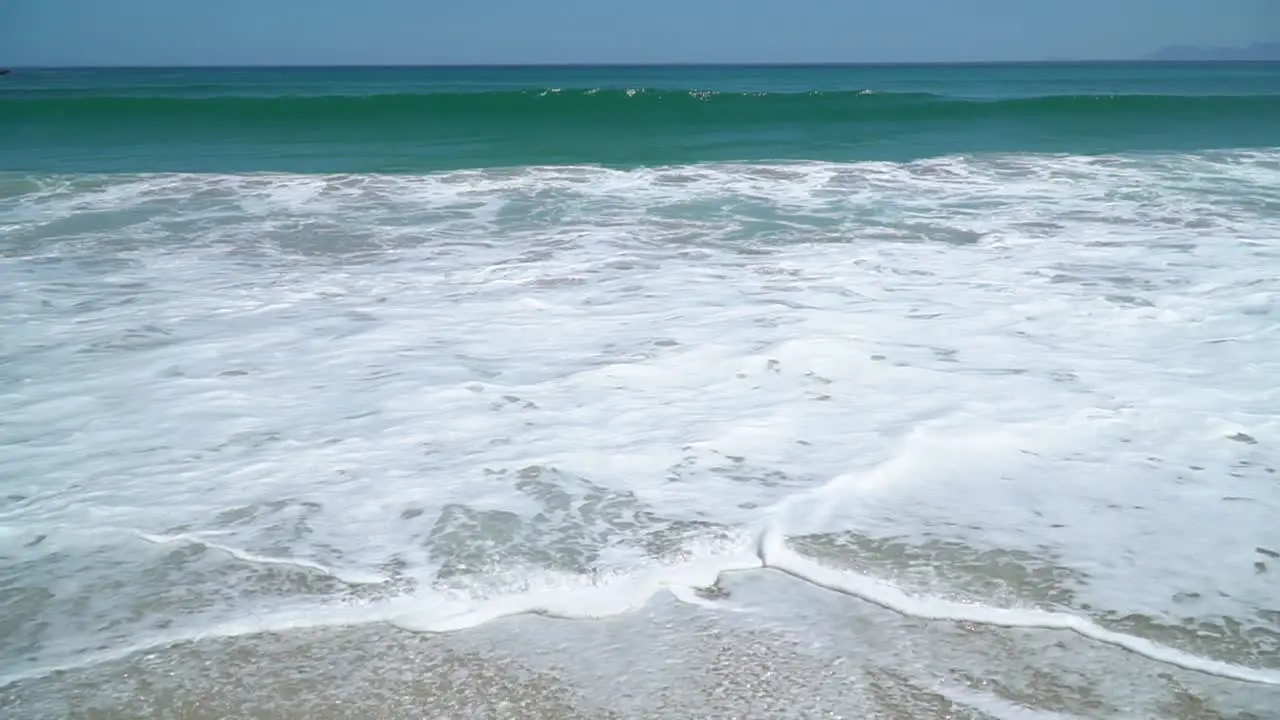 First Person View of Tropical Beach with Waves and Turquoise Water