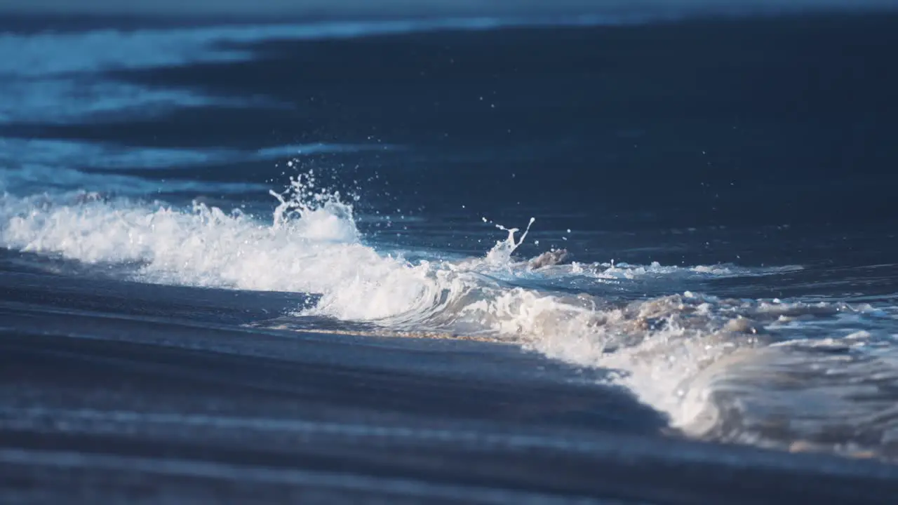 The powerful waves roll on the sandy shallows of the Ersfjord beach