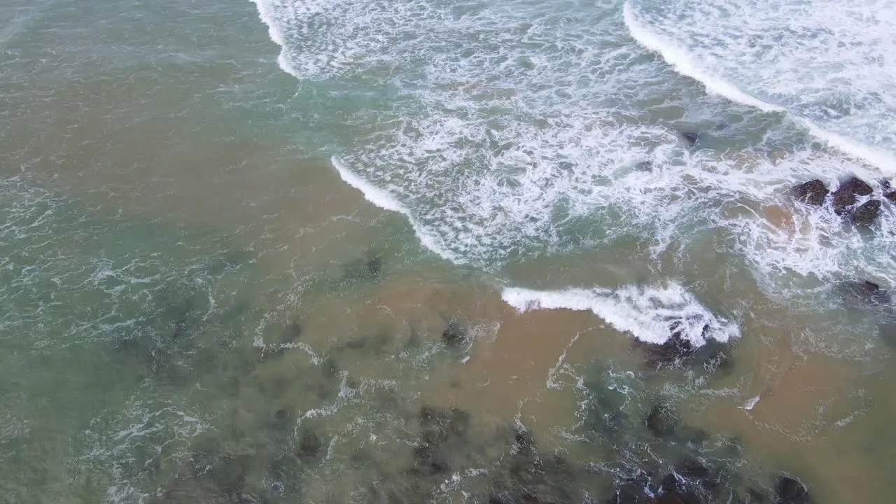 Drone Fly Towards Rocky Outcrops With Crashing Waves At Sawtell Beach Near Bonville Headland In New South Wales Australia