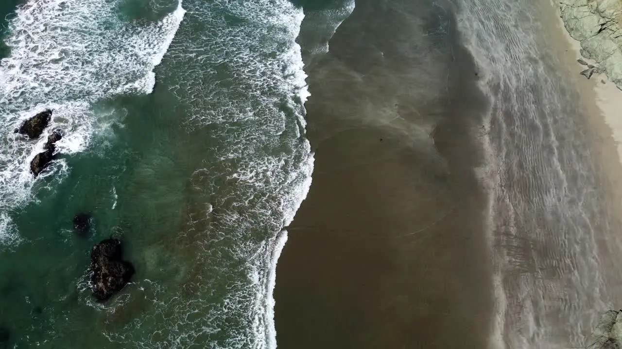 Waves coming in on rocky beach