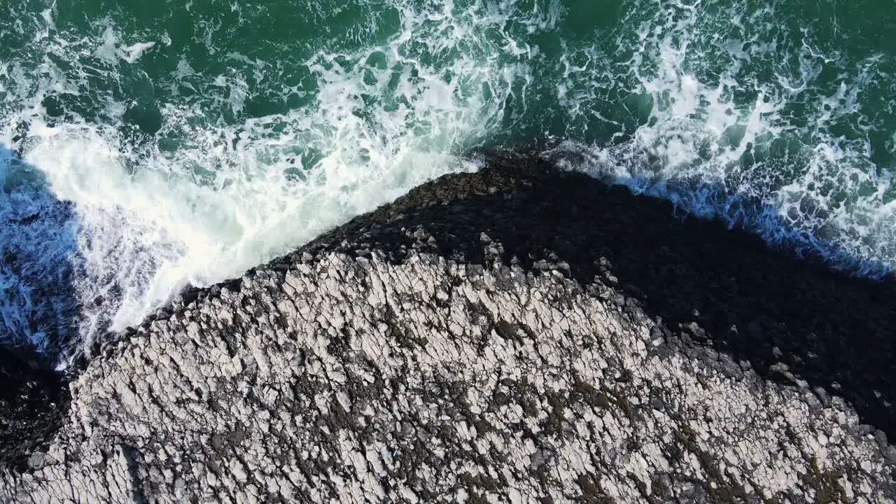 Rock formations next to big waves on Black Sea Region at Turkey Aerial Ascending Shot