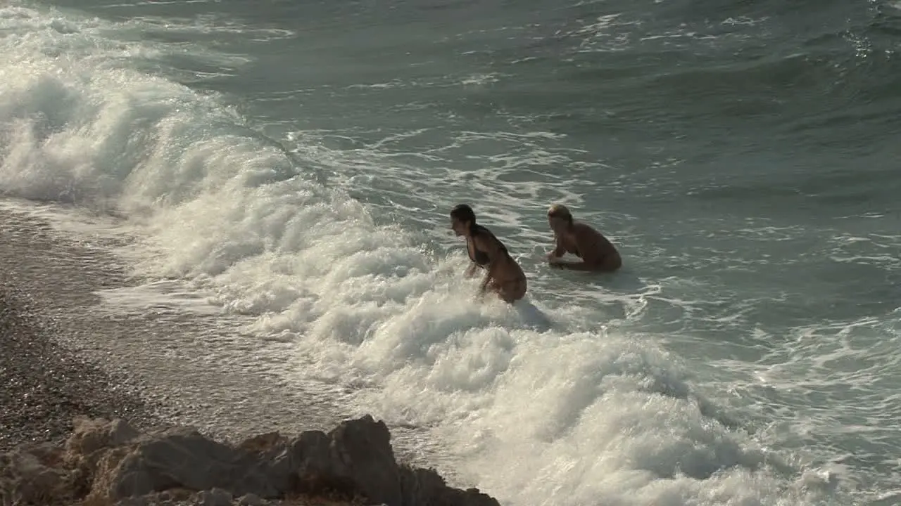 Girls and waves on the Gulf of Corinth