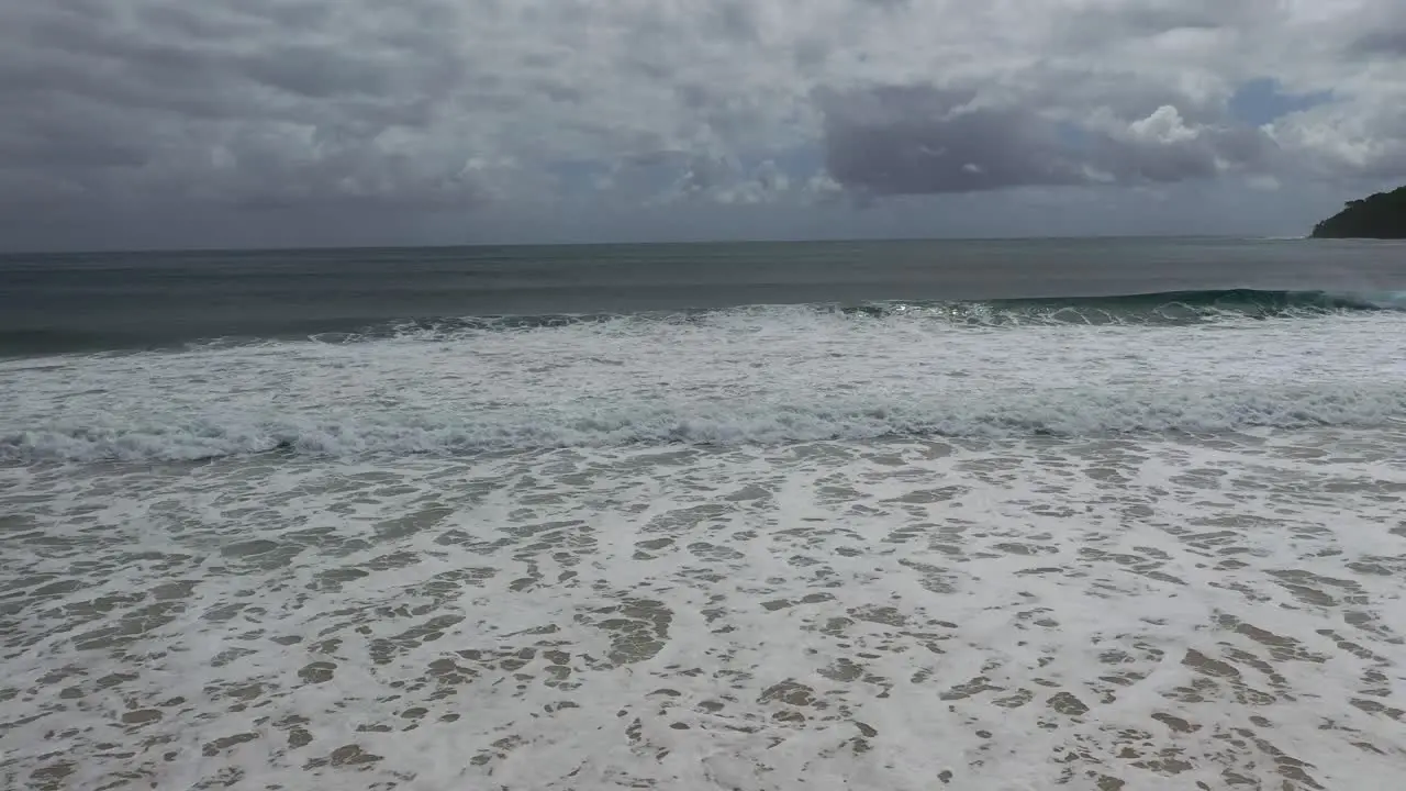 Waves rolling in on a windy day in Noosa