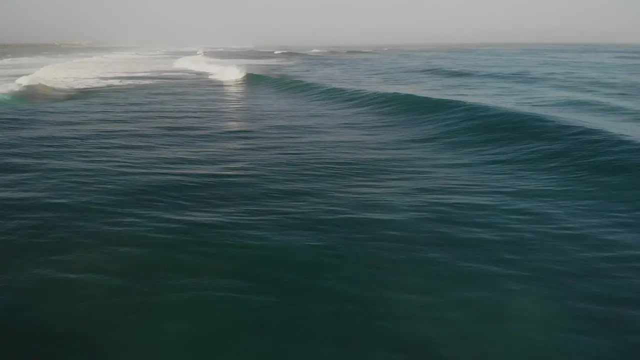 Waves Rolling In Foamy Surface Of A Seascape Shoreline