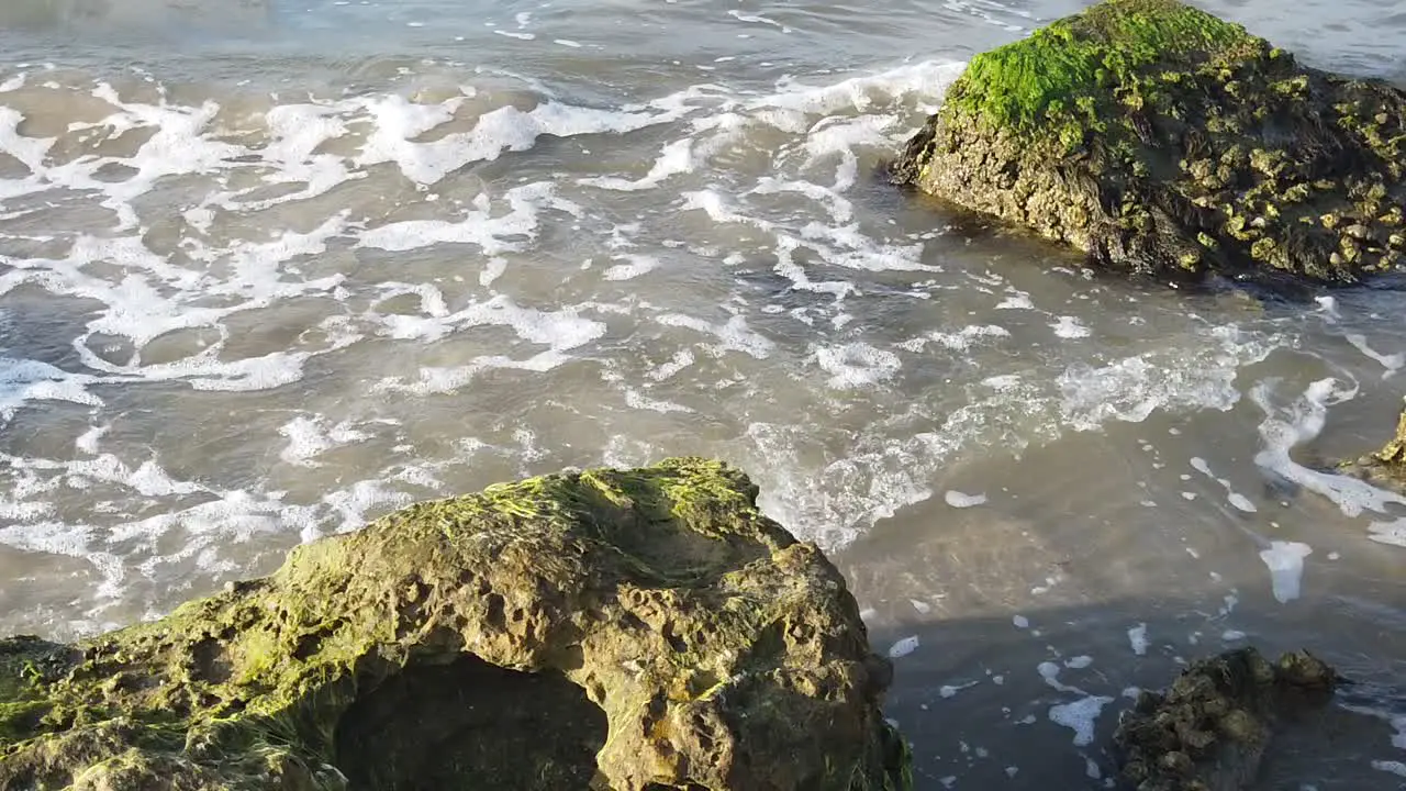 This is a slow motion video of waves crashing into rocks in Galveston Texas