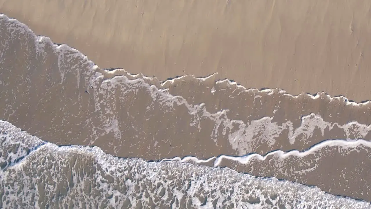 Beautiful top view motion of the sea waves in sunny day