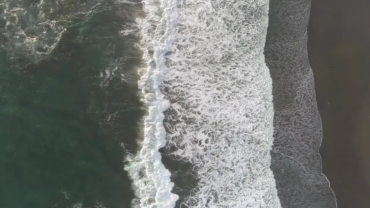 Aerial View of Waves Crashing Ashore