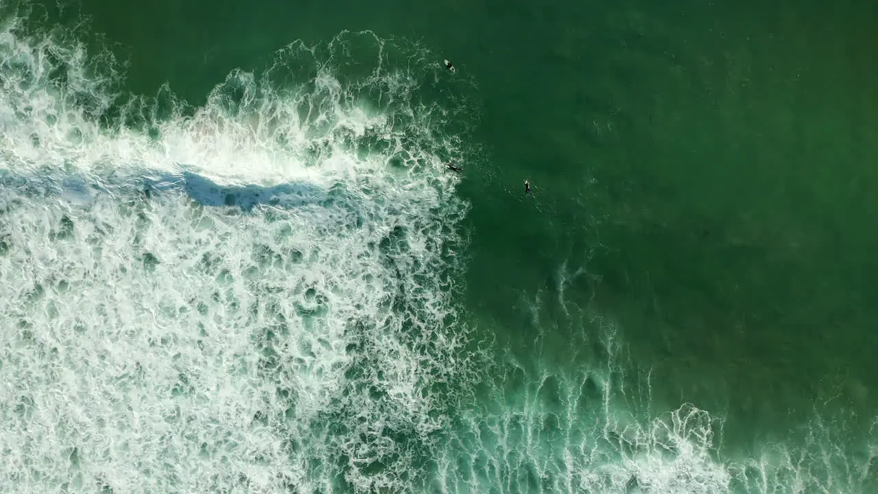 Top Down View Of Surfers At Kogel Bay Beach In Cape Town South Africa aerial drone shot