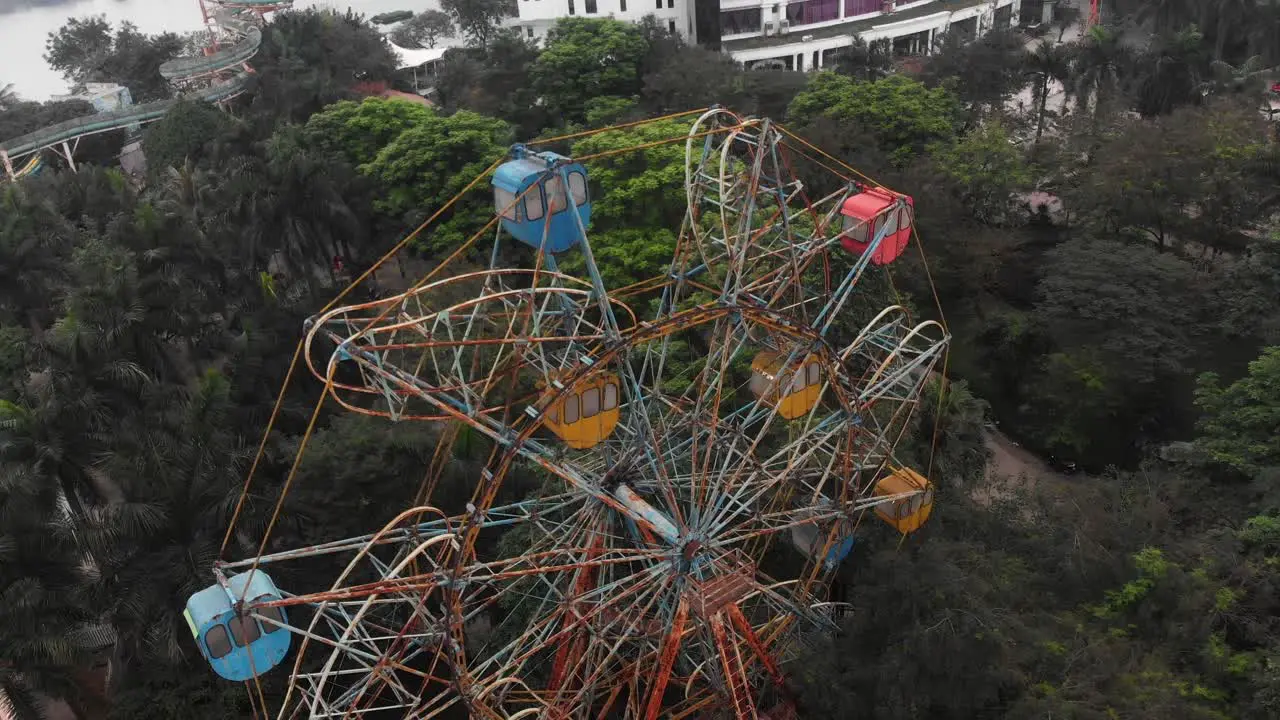 Flying around old abandoned ferris wheel at Hanoi Vietnam aerial