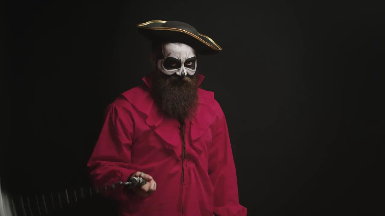 Bearded man with makeup and pirate costume