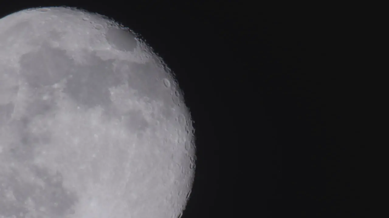 Close up view of the full moon against pitch black space