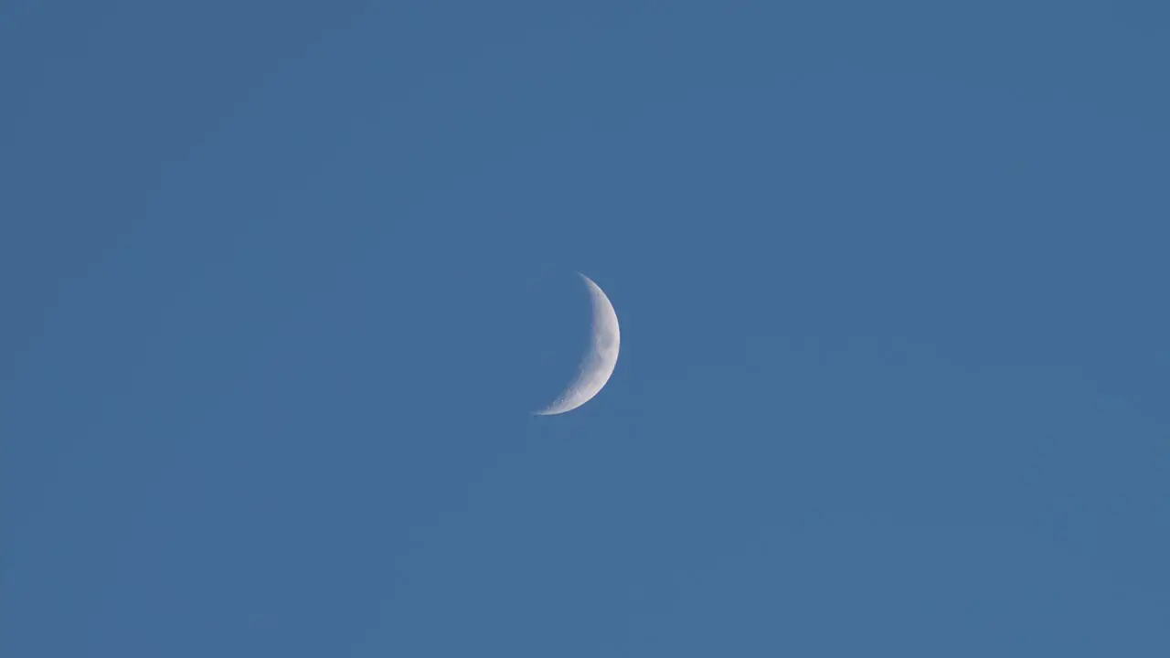 Wide Shot Of The Skies With A Pale Waxing Crescent Moon