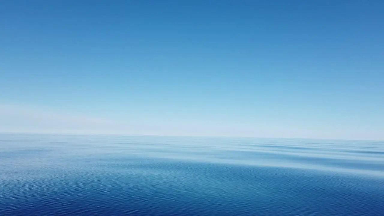 Clear water with no waves on Lake Michigan Great Lakes no land in sight cloudless day clear skies