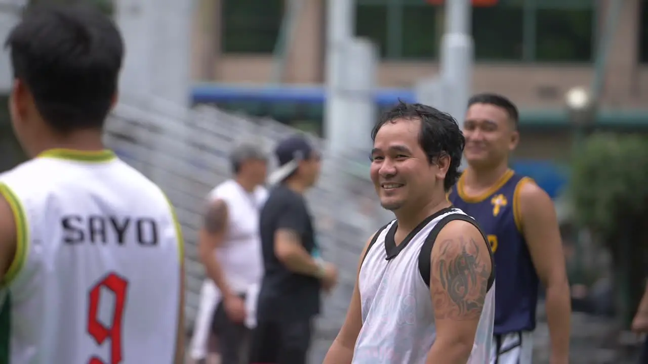 Smiling Man on Sports Ground