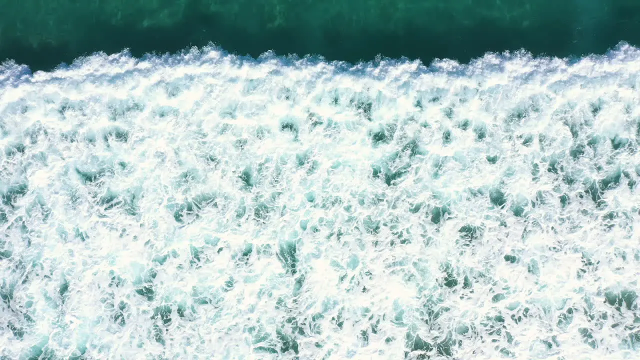 4k Drone shot of blue turquoise ocean wave break in the sea