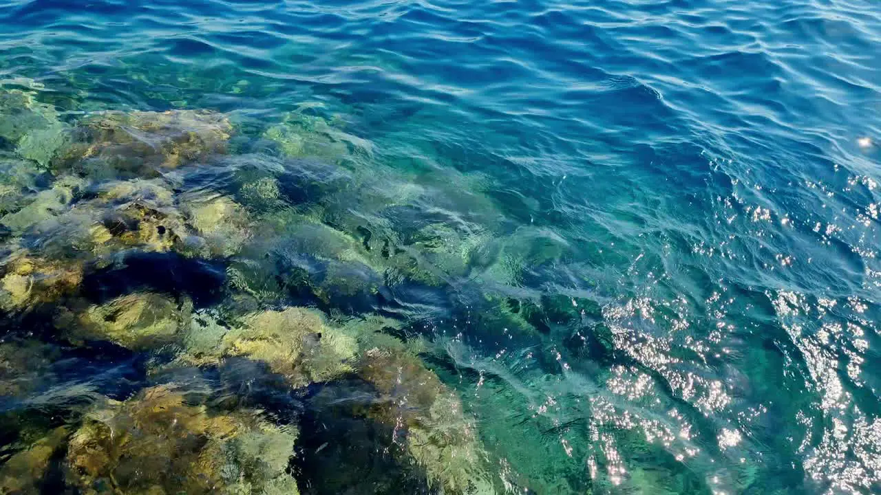 Close Shot Of Crystal Clear Water With Rocks In Brač island Bol Croatia