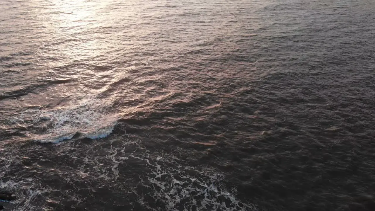 gorai beach dock waves on sun set dron shot birds eye view