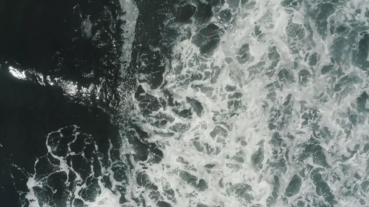 Topdown View Of Frothy Waves With Glistening Ocean In El Paredon Escuintla Guatemala