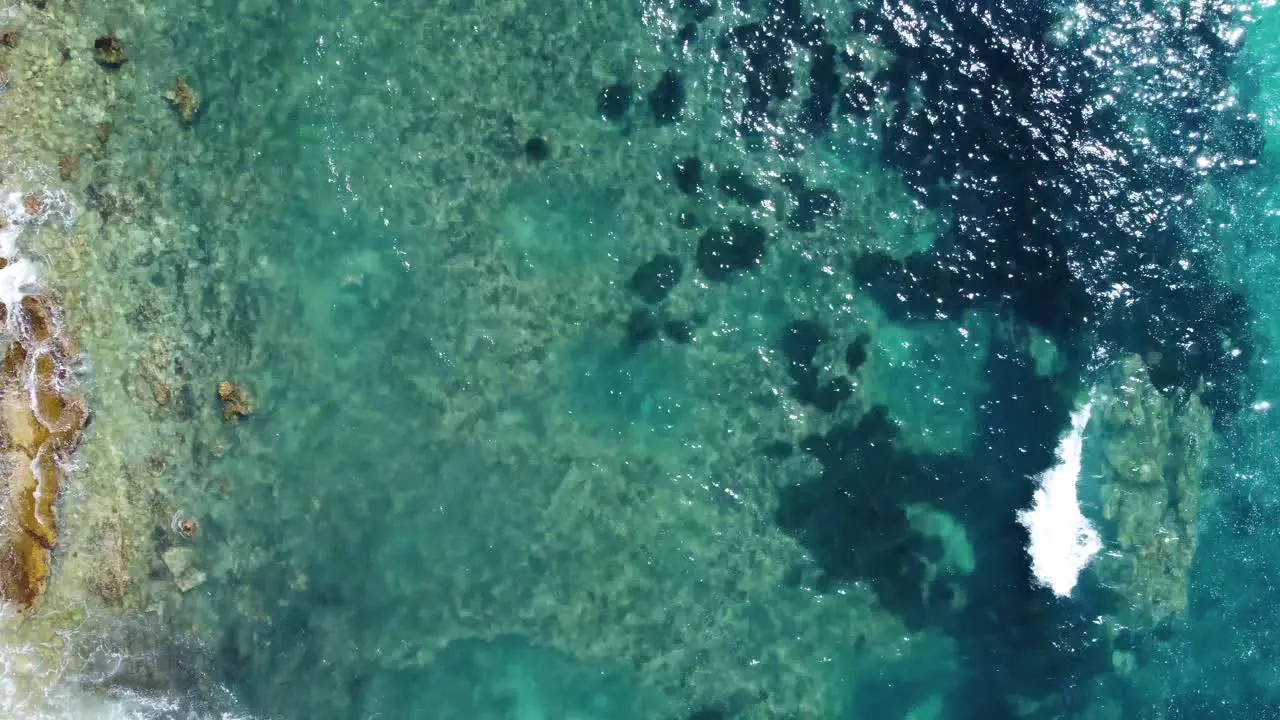 Aerial top down view of crystal clear sea water