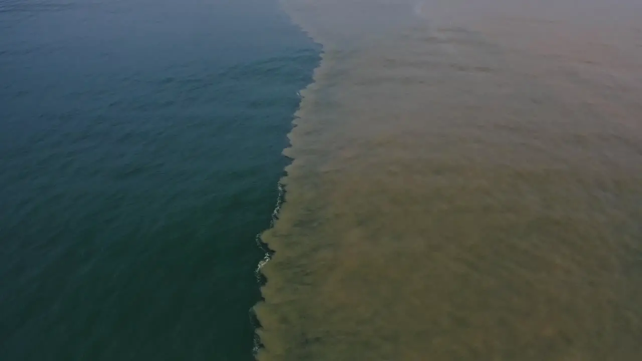 Aerial natural phenomenon seawater mixing with river freshwater in ocean