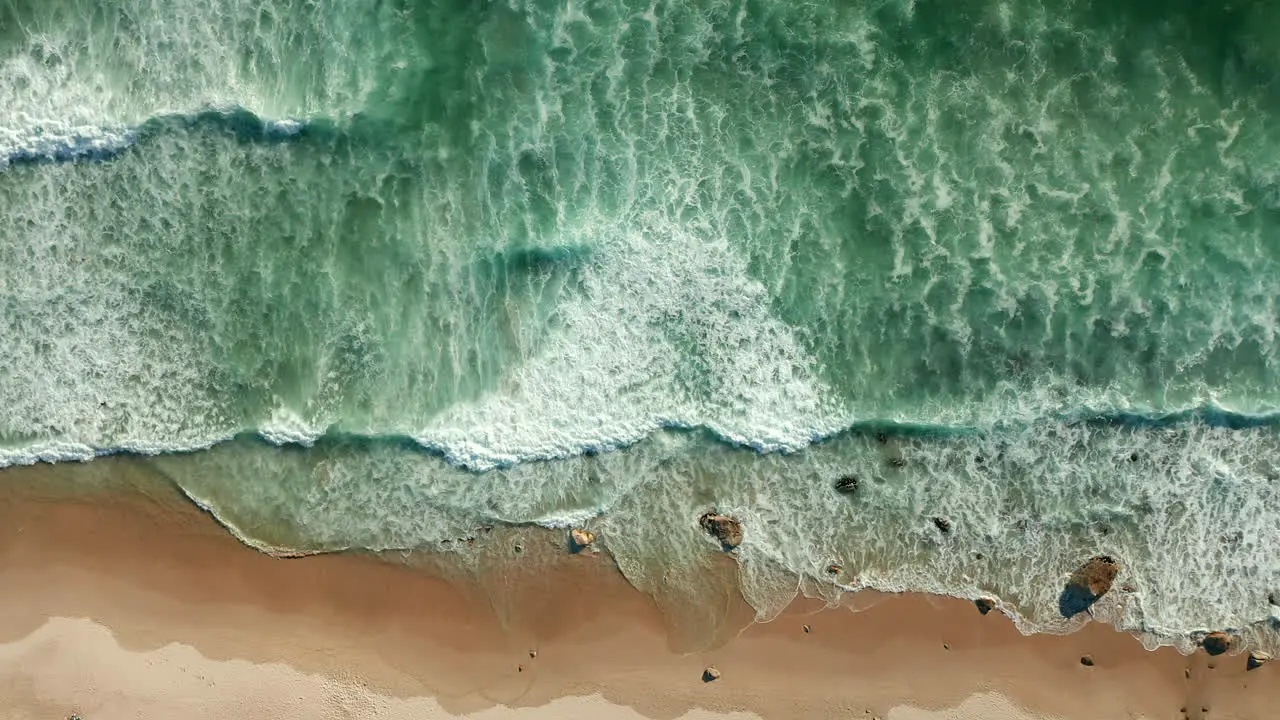 Foamy Sea Waves Splashing On Sandy Shore At Kogel Bay Beach Cape Town South Africa aerial top down