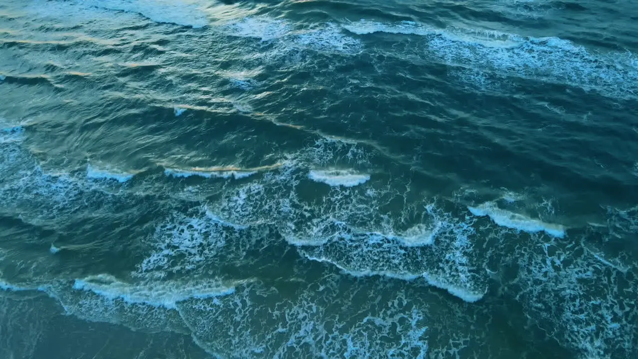 Waves breaking calmy over the shores of Karwia Poland