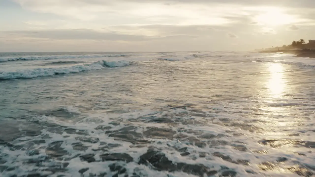 Ocean Waves And Black Sand Beach Of El Paredon In Guatemala At Sunset drone shot