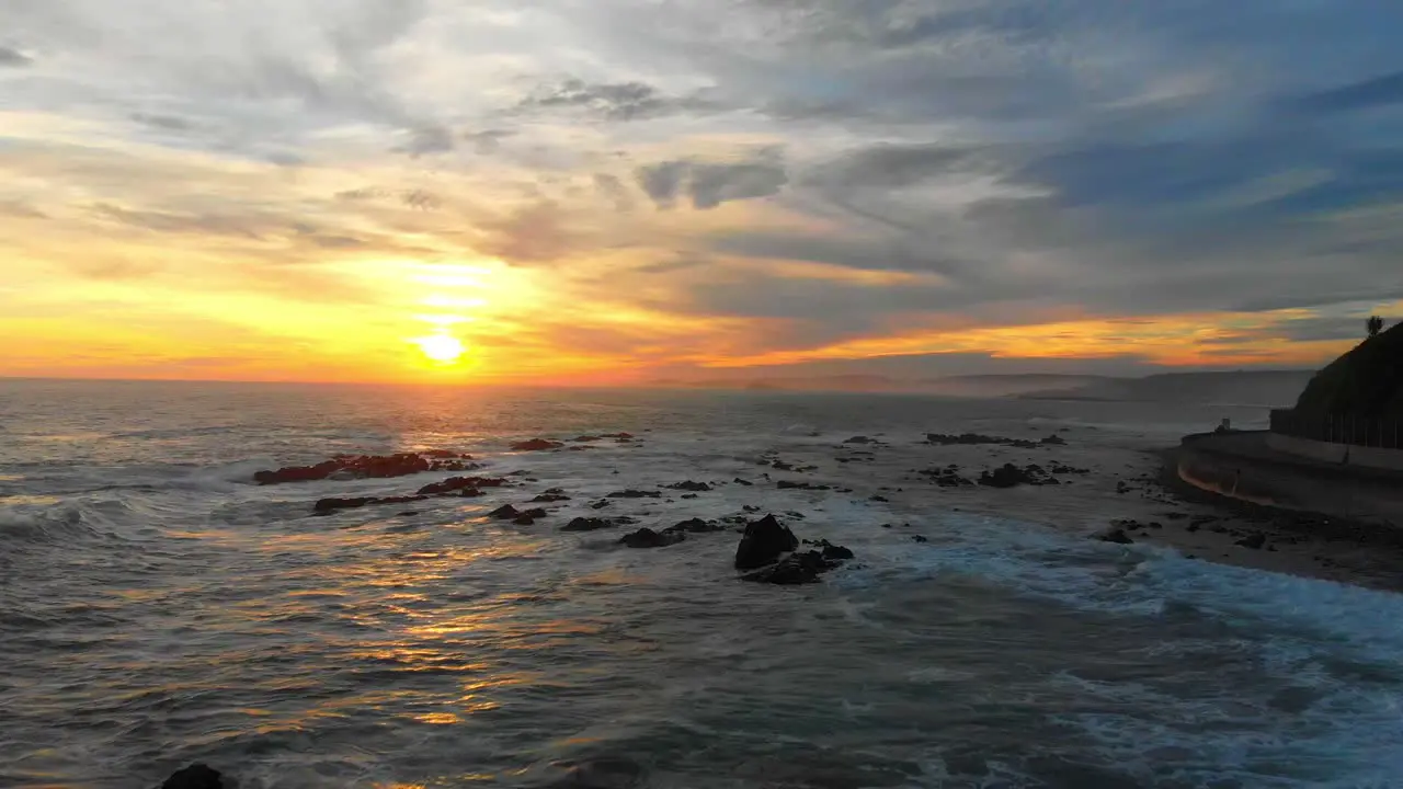 dramatic sunset along a rugged coast line