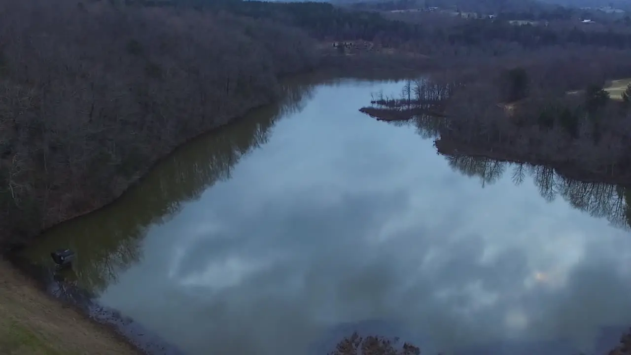 A drone flyover of a levy and lake