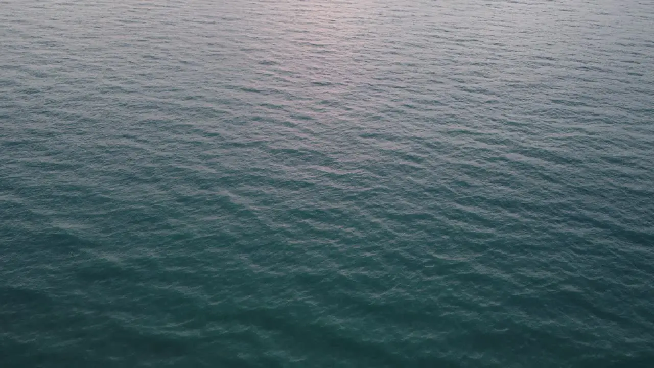 Waves of the ocean moving slowly in Miami Florida  filmed from above by drone