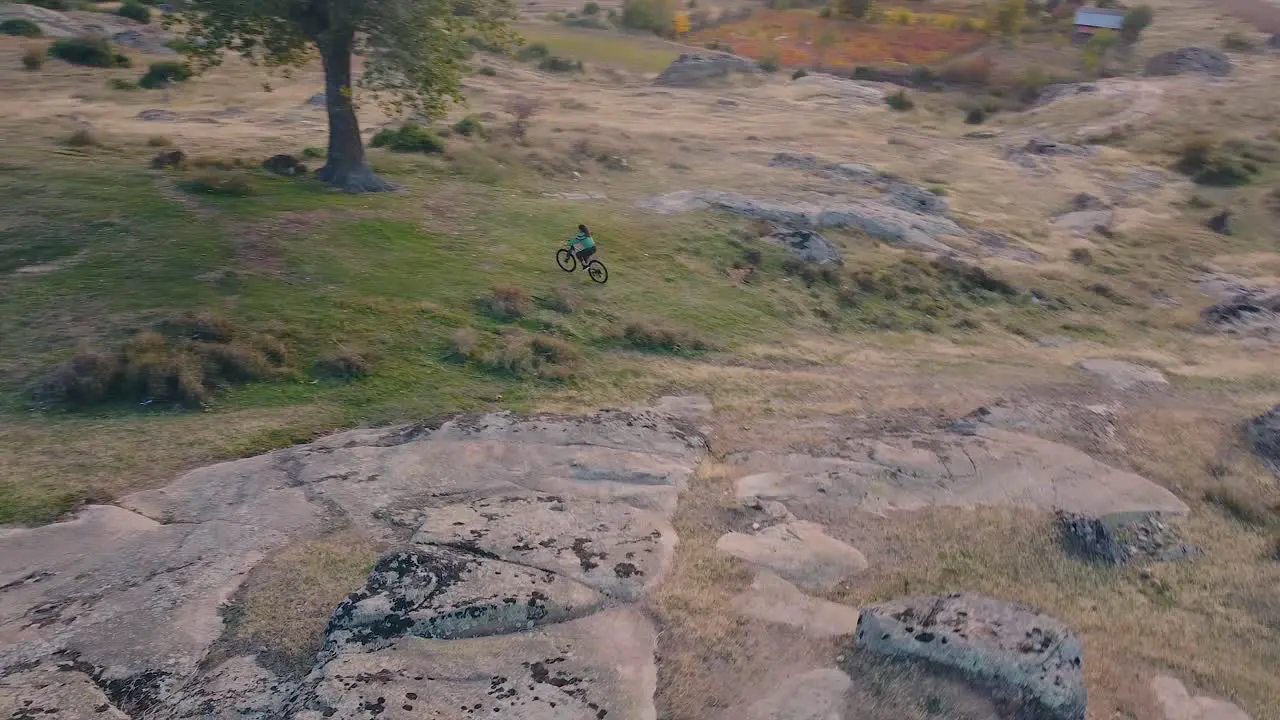 Girl riding a bike on a hill