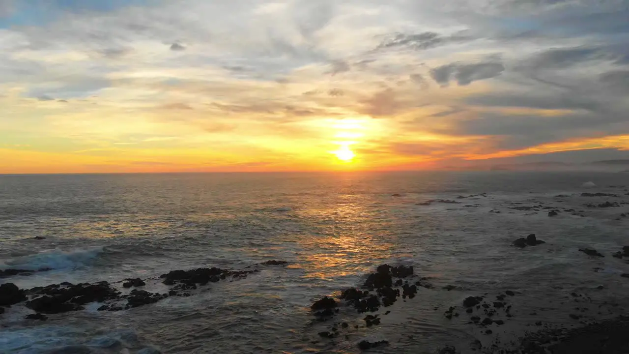 dramatic sunset along a rugged coastline