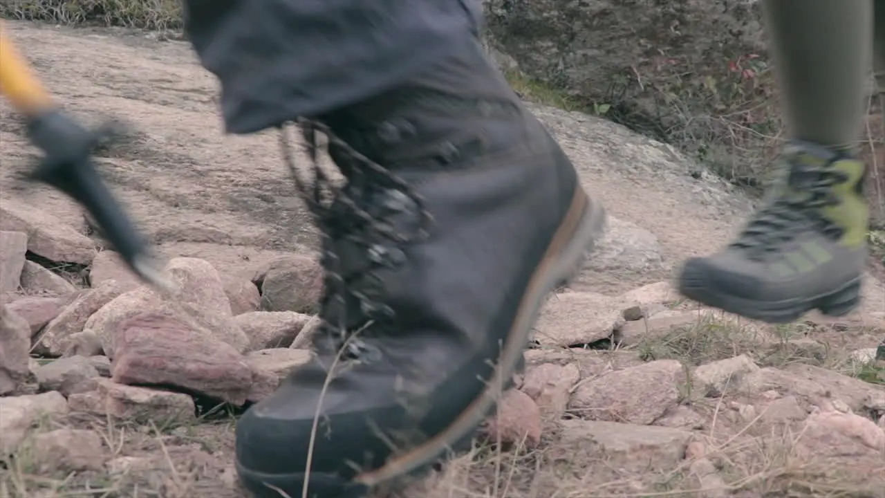 Hikers climbing a mountain path low angle