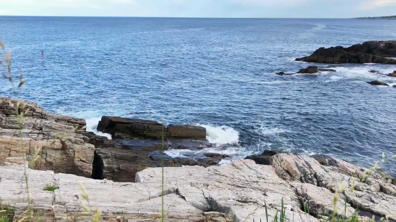 Beautiful Portland Maine waves crashing onto the rugged rocky coastline