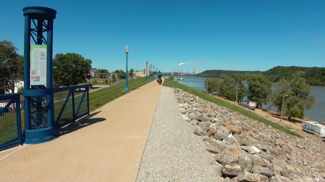 Cyclist bikepacking along the Ohio River on American Discovery Trail