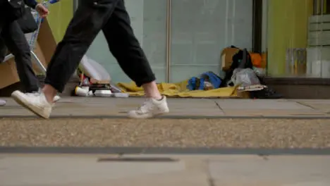 Long Shot of Homeless Persons Belongings In Doorway In Oxford 02