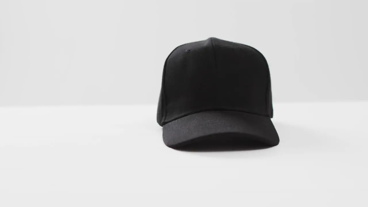 Video of black baseball cap and copy space on white background