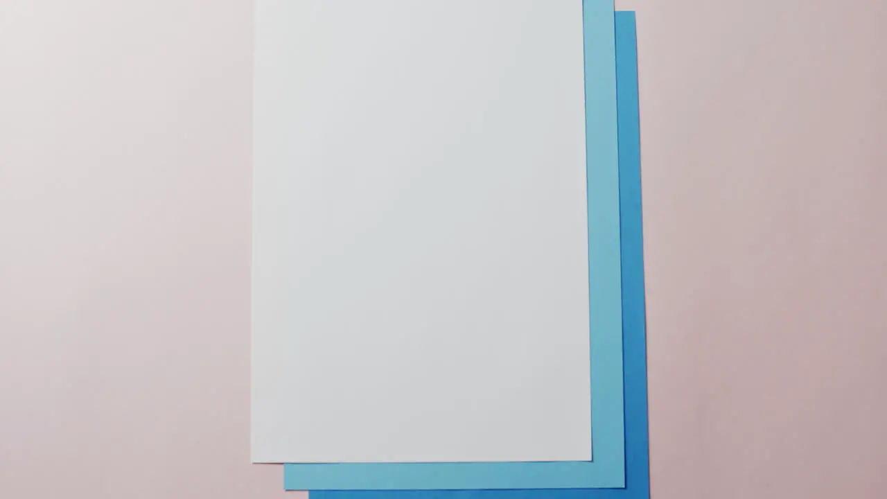 Close up of blank card on white background with copy space in slow motion