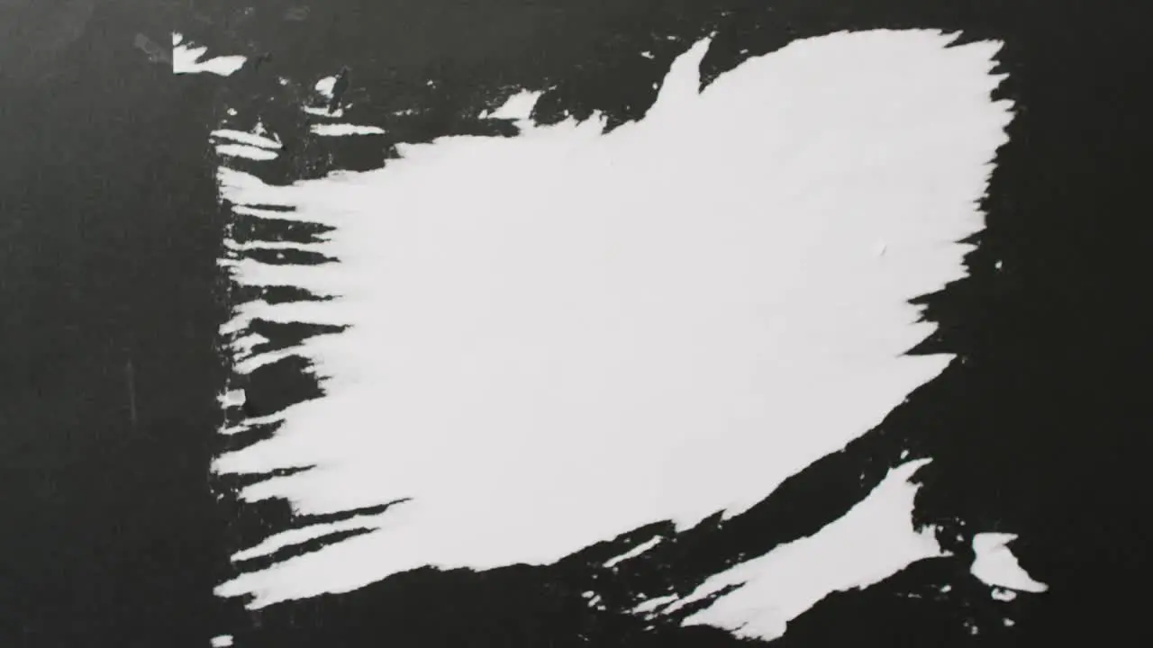 Video of close up of strokes of black paint with copy space on white background