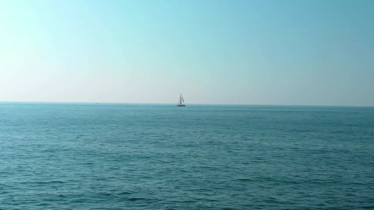 Sailboat far away in the sea